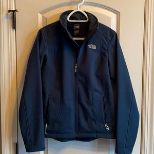 North face dark teal jacket with a furry lining.